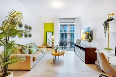a living room with a couch and a table at Hollywood Beach Haven Rooftop Pool Hot Tub in Hollywood