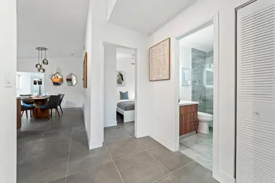 a white bathroom with a bedroom and a dining room at Luxurious Family Escape in Hialeah
