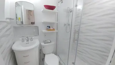 a bathroom with a shower and a toilet and a sink at Downtown Hollywood Boutique Hotel in Hollywood