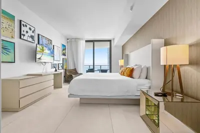 a bedroom with a white bed and a large window at Breathtaking Ocean-View Balcony Lyfe Resort in Hollywood Beach