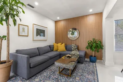 a living room with a couch and a table at Charming Home Close to Beaches & Downtown in Miami