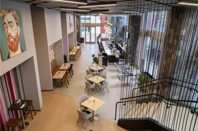a view of a restaurant with tables and chairs at Spacious Studio in the Heart of Downtown Miami in Miami