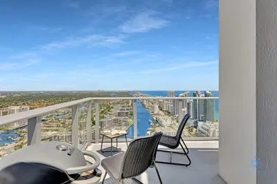a balcony with chairs and a view of the ocean at Penthouse with Free Parking and Beautiful Amenities in Hollywood