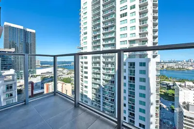 an apartment balcony with a view of a city at Gorgeous Unit in the Heart of Downtown Miami in Miami