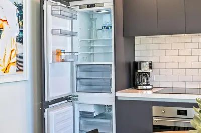 a refrigerator with its door open in a kitchen at Gorgeous Unit in the Heart of Downtown Miami in Miami