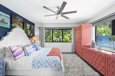 a bedroom with a bed and a ceiling fan at The Waterhouse- Amazing Villa With Infinity Pool in Miami