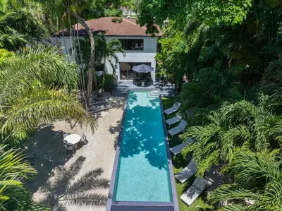an overhead view of a swimming pool in front of a house at The Waterhouse- Amazing Villa With Infinity Pool in Miami