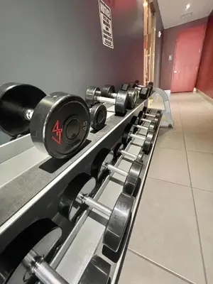 a row of dumbbells lined up in a gym at Beachwalk - 1 Bedroom & Kitchen Amazing Bay view in Hallandale Beach