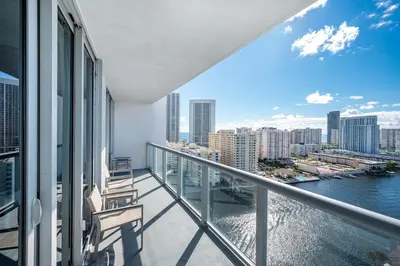 an apartment balcony with a view of the water at Beachwalk - 1 Bedroom & Kitchen Amazing Bay view in Hallandale Beach