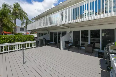 a large deck in front of a building at Cozy Retreat in Fort Lauderdale