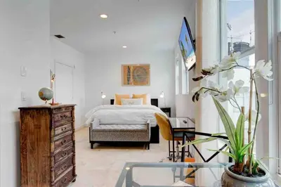 a bedroom with a bed and a dresser and a window at S BEACH SPOT Heated pool 2BLOCKs to BEACH BBQ in Miami Beach