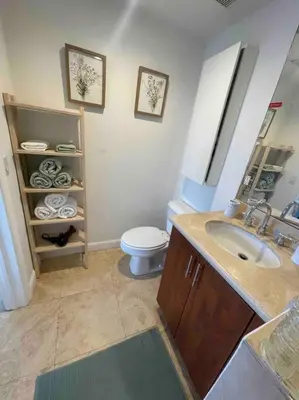 a bathroom with a sink and a toilet in it at S BEACH SPOT Heated pool 2BLOCKs to BEACH BBQ in Miami Beach