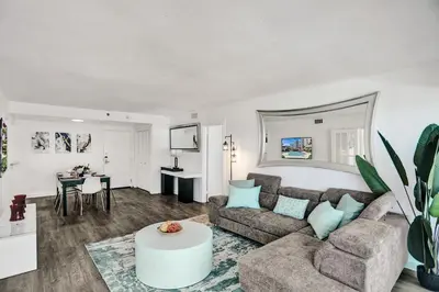 a living room with a couch and a table at Adorable 2 Bedroom Condo Beach Service 1110 in Miami Beach