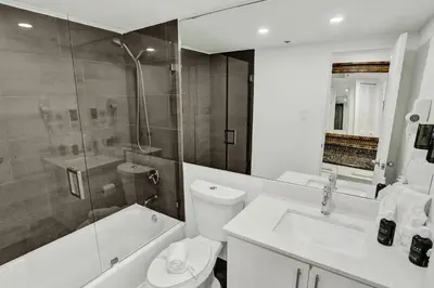 a bathroom with a toilet and a shower and a sink at Adorable 2 Bedroom Condo Beach Service 1110 in Miami Beach