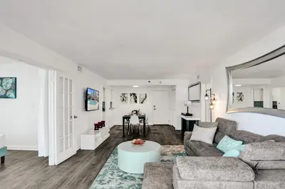 a living room with a couch and a table at Adorable 2 Bedroom Condo Beach Service 1110 in Miami Beach