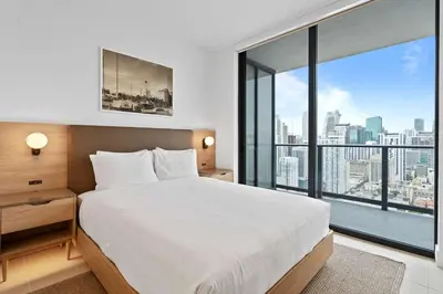 a bedroom with a large bed and a large window at Orange Crush - Resort-Style Amenities & Location in Miami