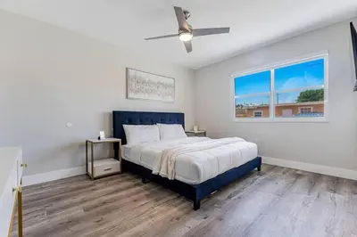 a bedroom with a bed and a ceiling fan at Miami Modern Oasis Retreat - Close to Airport in Miami
