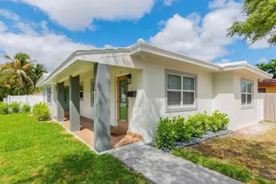a house with a green lawn in front of it at Executive Retreat Unit 1 - Fort Lauderdale in Fort Lauderdale