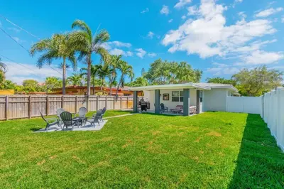a backyard with chairs and a house at Executive Retreat Unit 1 - Fort Lauderdale in Fort Lauderdale