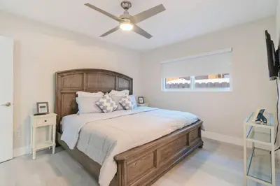 a bedroom with a bed with a ceiling fan at Executive Retreat Unit 1 - Fort Lauderdale in Fort Lauderdale