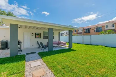 a backyard with a couch and a table at Executive Retreat Unit 1 - Fort Lauderdale in Fort Lauderdale
