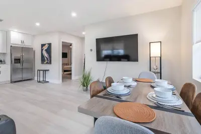 a dining room and living room with a table and chairs at Cozy Victoria Park Retreat Unit 3 - Las Olas Beach in Fort Lauderdale