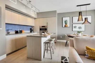 a kitchen with a counter and a bar in a room at 1BR Apartment - Near Beach - Amazing pool in Hollywood