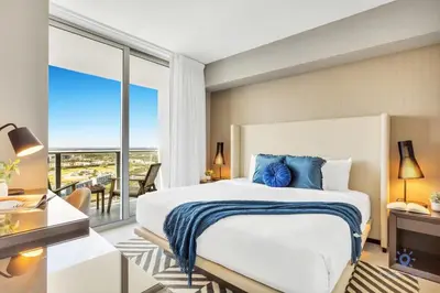 a bedroom with a large bed and a large window at 1BR Apartment - Near Beach - Amazing pool in Hollywood