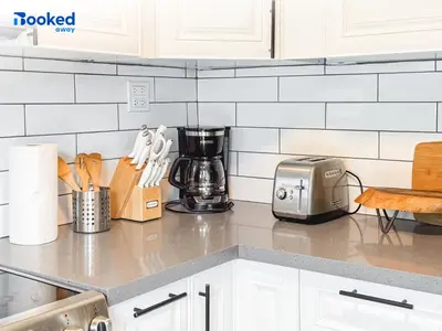 a kitchen counter with a coffee maker and a toaster at HOUSE WITH POOL and BBQ, 12 MIN to the BEACH in Miami Shores