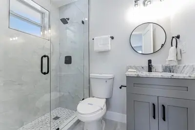 a bathroom with a shower and a toilet and a sink at Modern Oasis Unit 2 - Close to Beach, Brickell & Airport in Miami