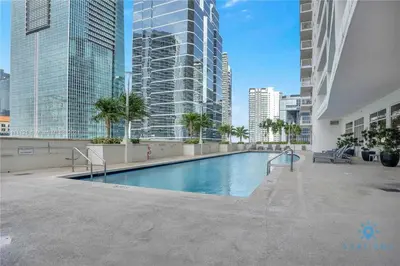 a swimming pool in a city with tall buildings at Beautiful 1BR Apartment with Amenities in Miami