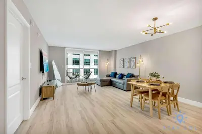 a living room with a couch and a table at Beautiful 1BR Apartment with Amenities in Miami