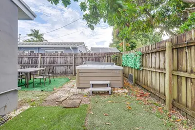 a backyard with a grill in the yard at Hollywood Hideaway Close to Dtwn and Beaches in Hollywood