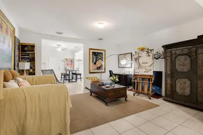 a living room with a couch and a table at Private Rooms at Miami, Buena Vista with Parking in Miami