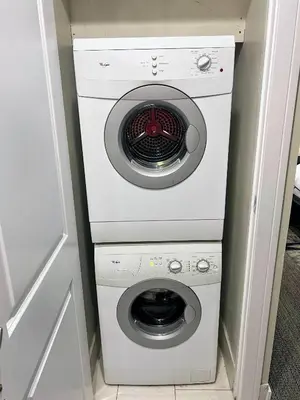 a washer and dryer in a small room at Doral Pool 310 by WaveProperties in Miami