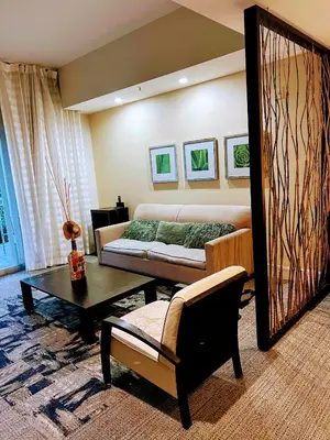 a living room with a couch and a table at Doral Pool 310 by WaveProperties in Miami