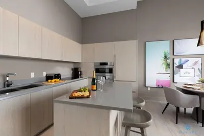 a kitchen with a table with a plate of fruit on it at 1 BR Apartment with Bay View and Parking Included in Hollywood