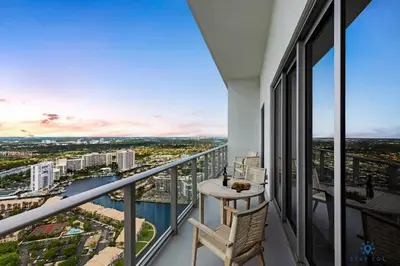 a balcony with a table and chairs and a view at 1 BR Apartment with Bay View and Parking Included in Hollywood