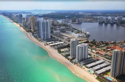 an aerial view of a beach with buildings and the ocean at 1BR Apartment with beautiful view in Sunny Isles Beach