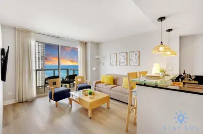 a living room with a couch and a table at 1BR Apartment with beautiful view in Sunny Isles Beach
