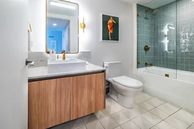 a bathroom with a sink and a toilet and a tub at Stunning 2 Bed 2 Bath w balcony & incredible views in Miami
