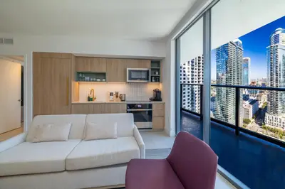 a living room with a white couch and a large window at Stunning 2 Bed 2 Bath w balcony & incredible views in Miami