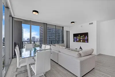a living room with a couch and a table at Luxury Downtown Miami Apartment in Miami