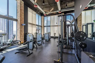 a gym with treadmills and cardio equipment in a building at Luxury Downtown Miami Apartment in Miami