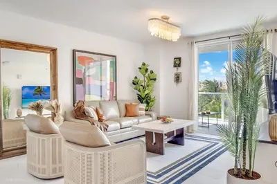 a living room with a couch and a table at Lux 3BR City-View Retreat in Hollywood, 5th Floor in Hollywood