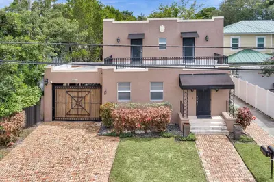 a house with a brick yard with a garage at Ft Lauderdale Casa de Las Olas in Fort Lauderdale