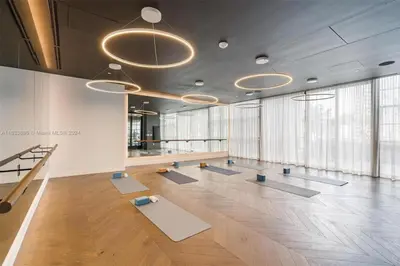 a large room with yoga mats on the floor at 2 bedroom Condo at Gale Downtown Pool Gym SPA in Miami