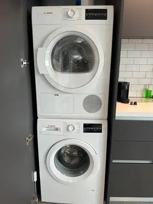 a washing machine and a dryer in a kitchen at 2 bedrooms Design Condo Downtown Miami Pool and Gym in Miami