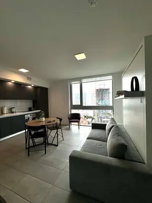 a living room with a couch and a table at 2 bedrooms Design Condo Downtown Miami Pool and Gym in Miami