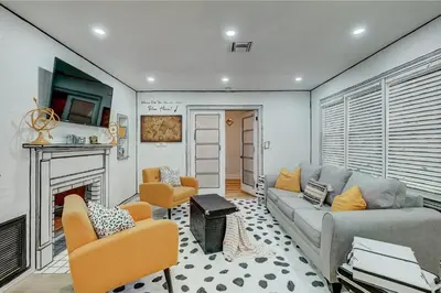 a living room with a couch and a fireplace at Most Unique Space in Fort Lauderdale